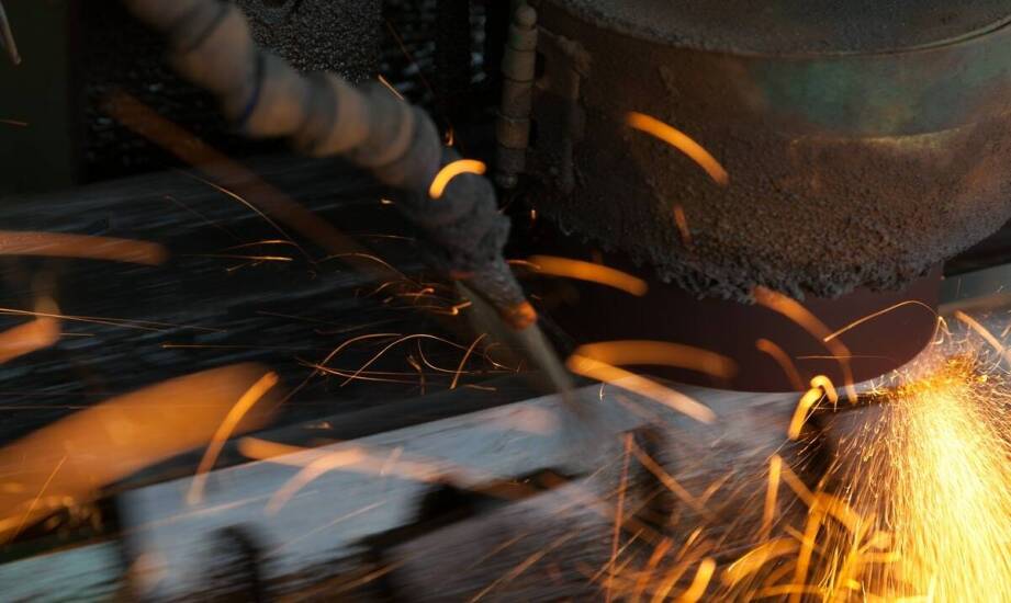 How do deburring machines improve sheet metal production quality?