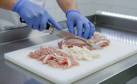 How Is Fine Trimming Meat from Pork Heads Prepared for Consistent Composition?