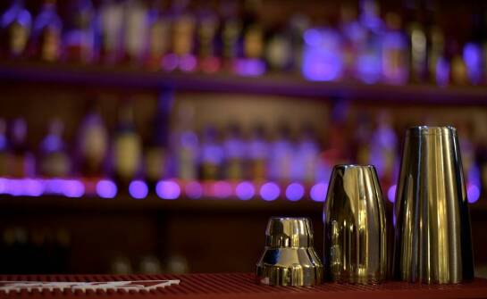 Custom PVC bar mats as a visual identity element for a venue