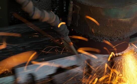 How do deburring machines improve sheet metal production quality?