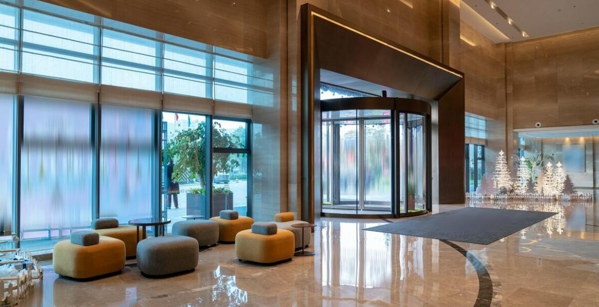 What are the advantages of using personalized entrance mats in sports facilities?