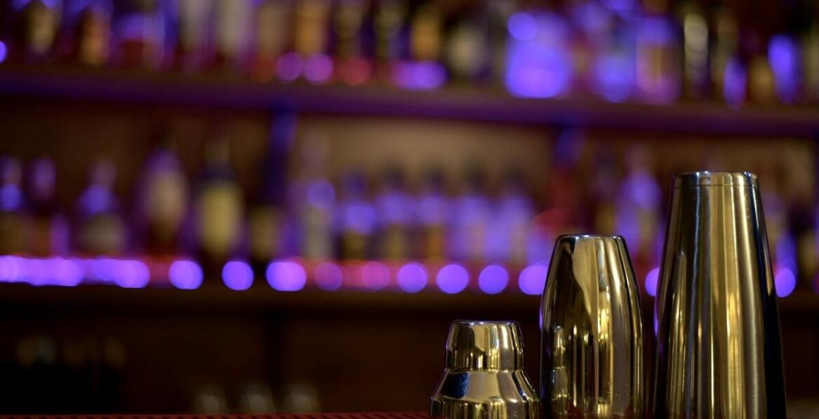 Custom PVC bar mats as a visual identity element for a venue